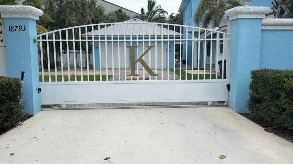 White aluminum slide gate installation