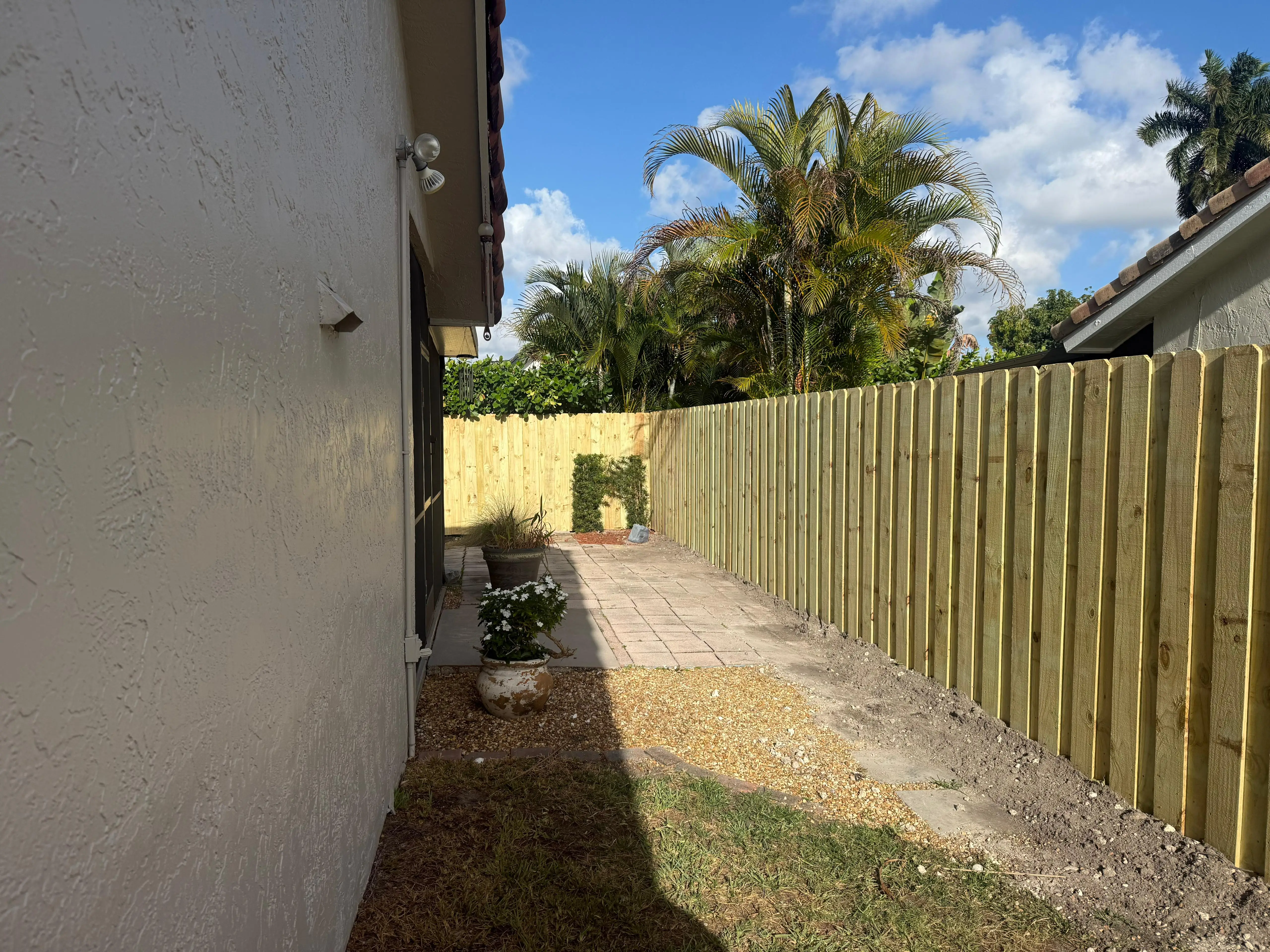Wood privacy fence installation